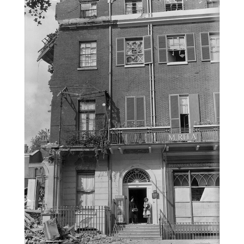 Bomb damage, Berkeley Square, London, showing Yevonde and an assistant in the doorway, with retrieved Day Books and lights Portrait Print